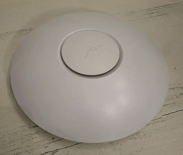 An original white Ubiquiti UniFi AP